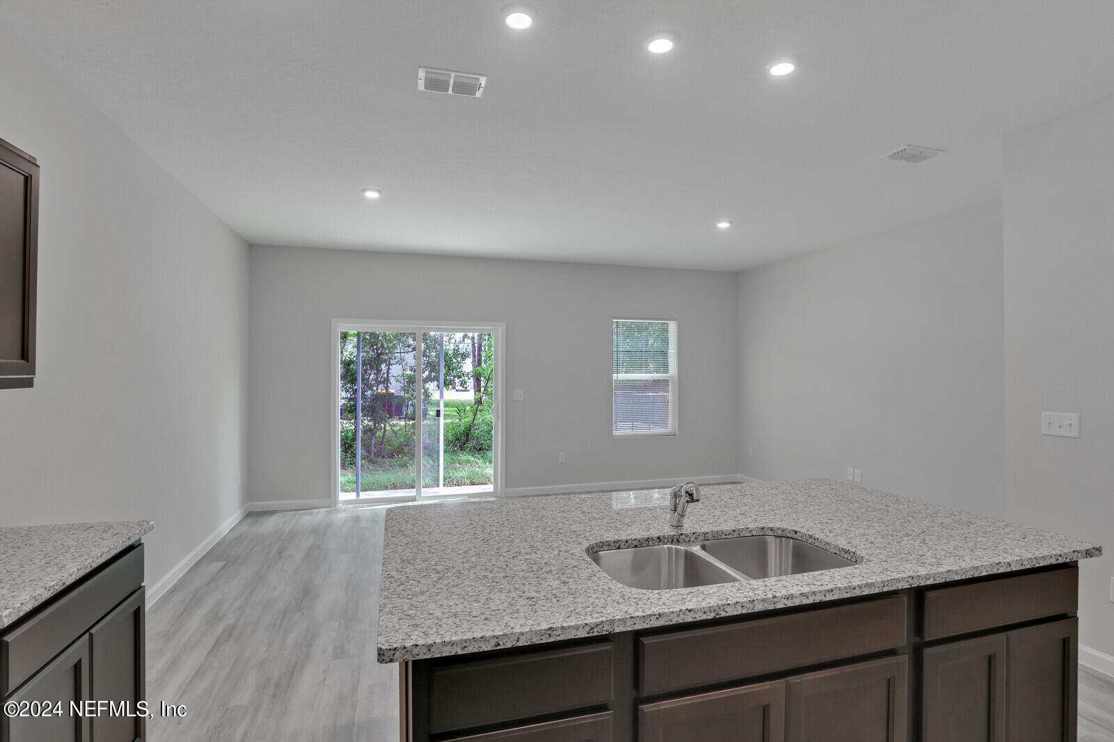 6644 Talking Tree Court Jacksonville, FL 32205 - Photo 8 of 22 Kitchen Overlooking Living Area