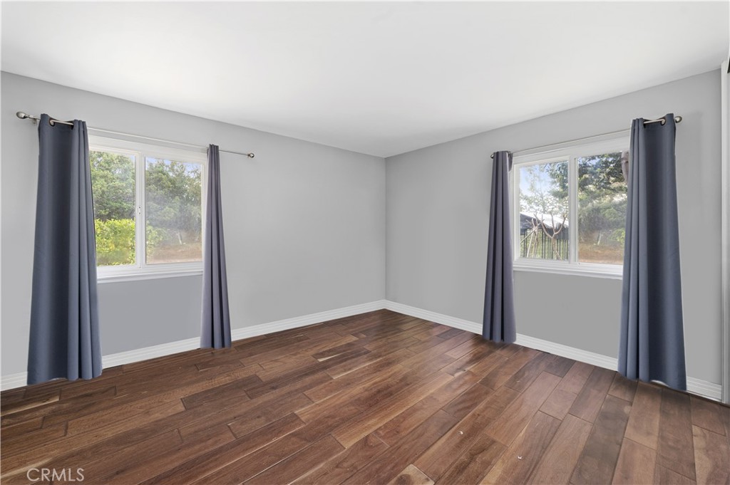 2631 Big Wagon Road Alpine, CA 91901 - Photo 27 of 49 a view of an empty room with wooden floor and a window