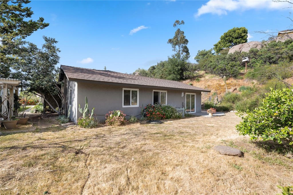 2631 Big Wagon Road Alpine, CA 91901 - Photo 43 of 49 a front view of a house with a yard and garage