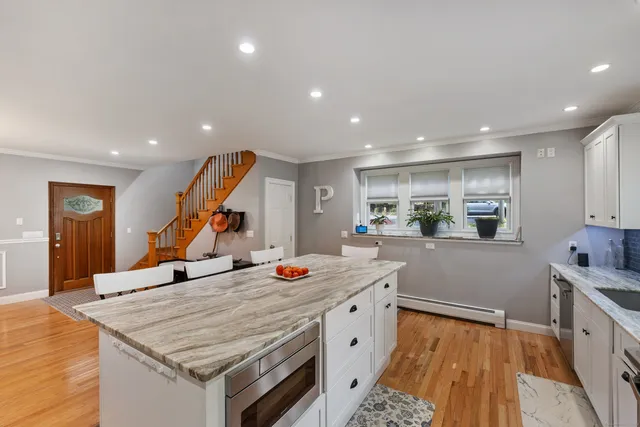 a very nice looking kitchen with a large window