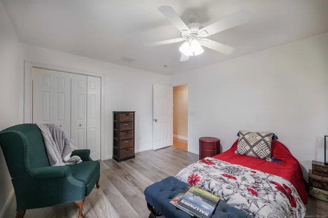 a bedroom with a bed and furniture