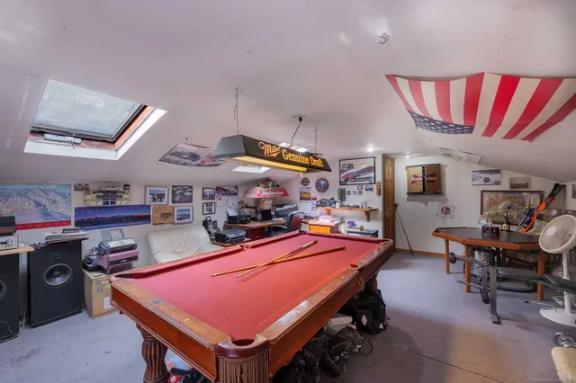 a room with stainless steel appliances kitchen island granite countertop breakfast area
