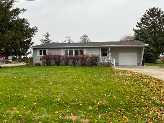 6081 South Woodlawn Road Rochelle, IL 61068 - Photo 1 of 8 a view of a house with yard and tree s