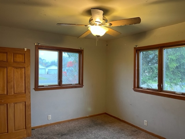 6081 South Woodlawn Road Rochelle, IL 61068 - Photo 6 of 8 a view of an empty room with a window