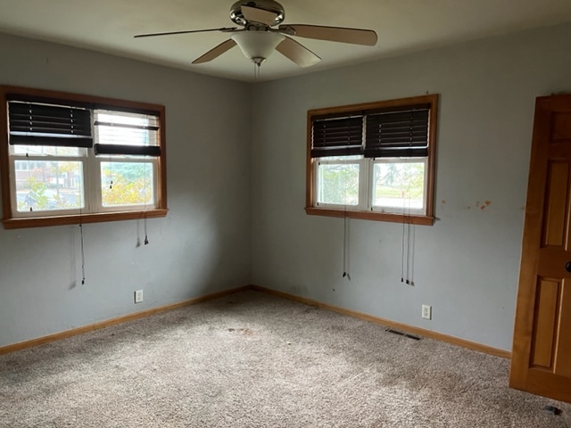 6081 South Woodlawn Road Rochelle, IL 61068 - Photo 7 of 8 an empty room with a window