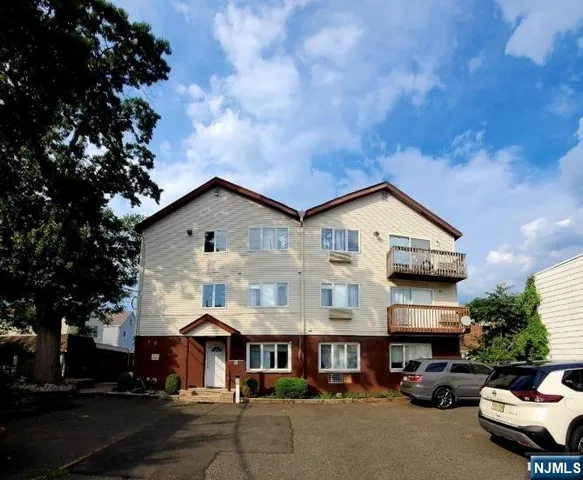 a view of multiple houses with a street