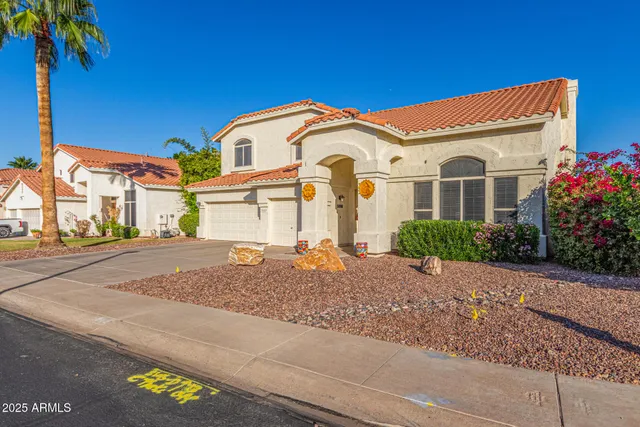 a front view of a house with a garage