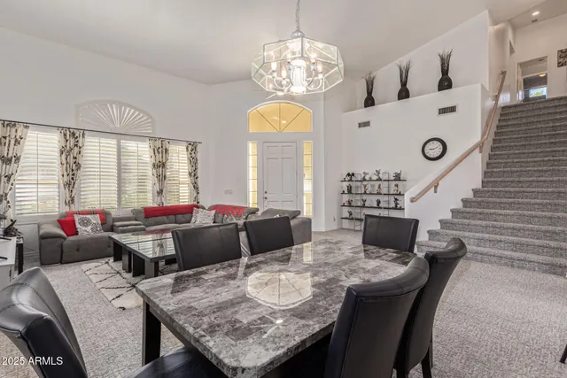 a picture of a room with a white wall and a large window