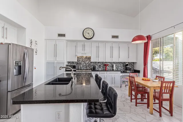 a living room with furniture a fireplace and a window