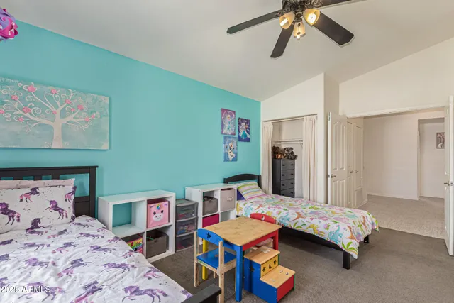 a bedroom with furniture and a window
