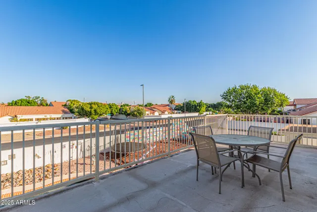 a bed room with a bed and a chandelier