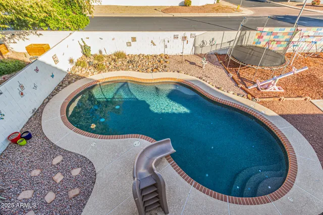 a bedroom with a bed couch and window