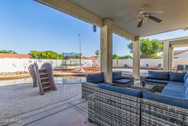 a bedroom with a bed a desk and chair