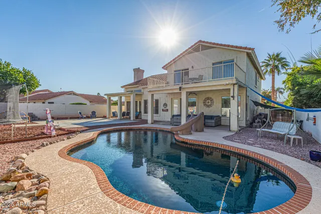 a view of swimming pool from a balcony