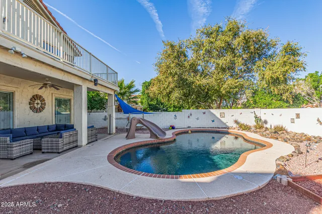 a view of a patio with a table and chairs