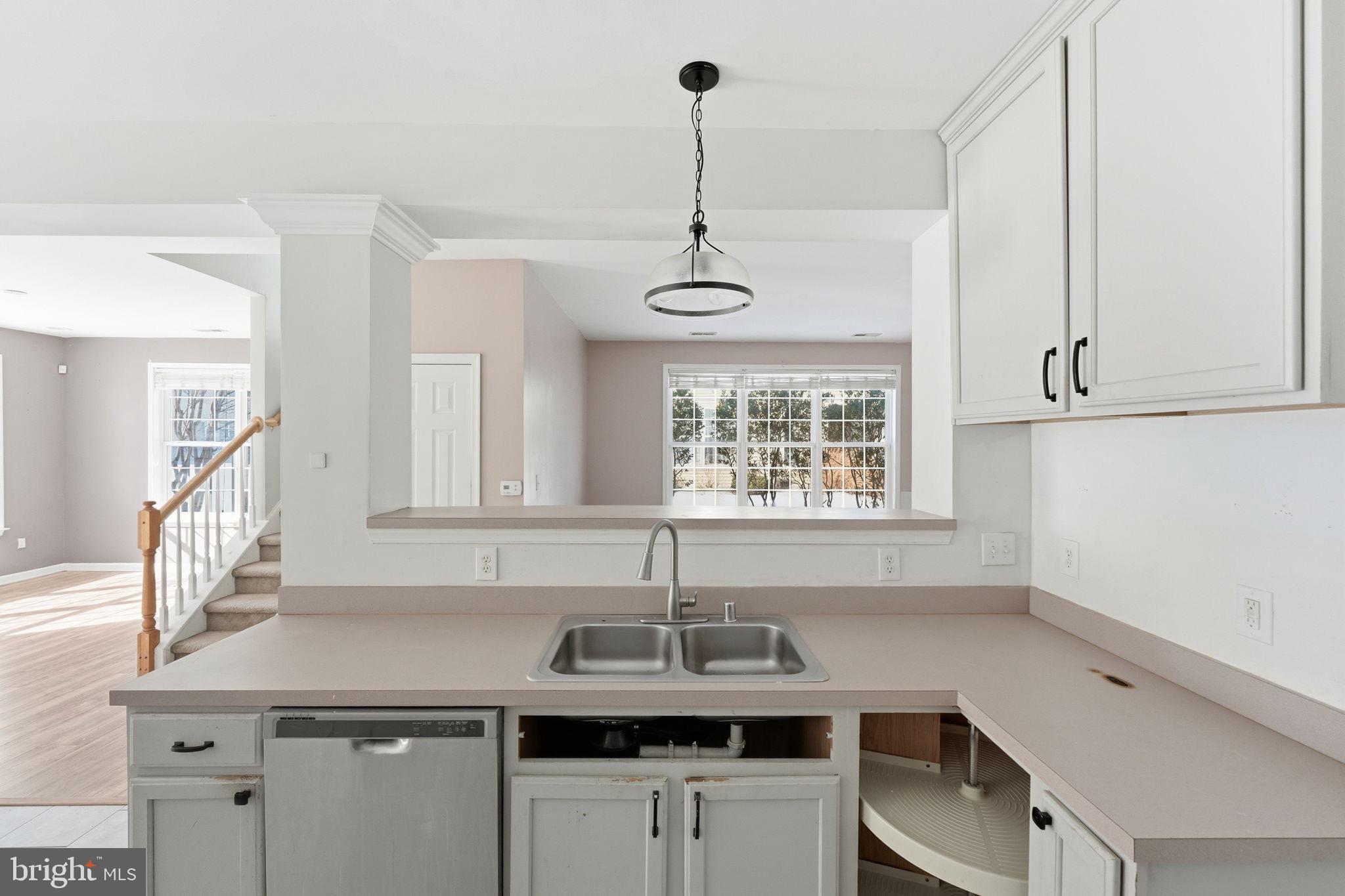 187 Gillespie Avenue Middletown, DE 19709 - Photo 12 of 43 a kitchen with a sink cabinets appliances and a window
