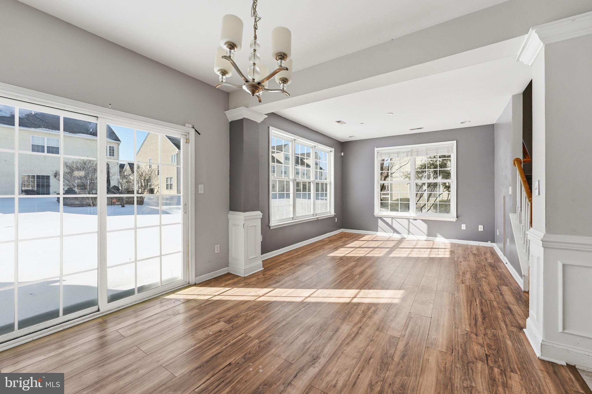 187 Gillespie Avenue Middletown, DE 19709 - Photo 16 of 43 a view of an empty room with wooden floor and a window