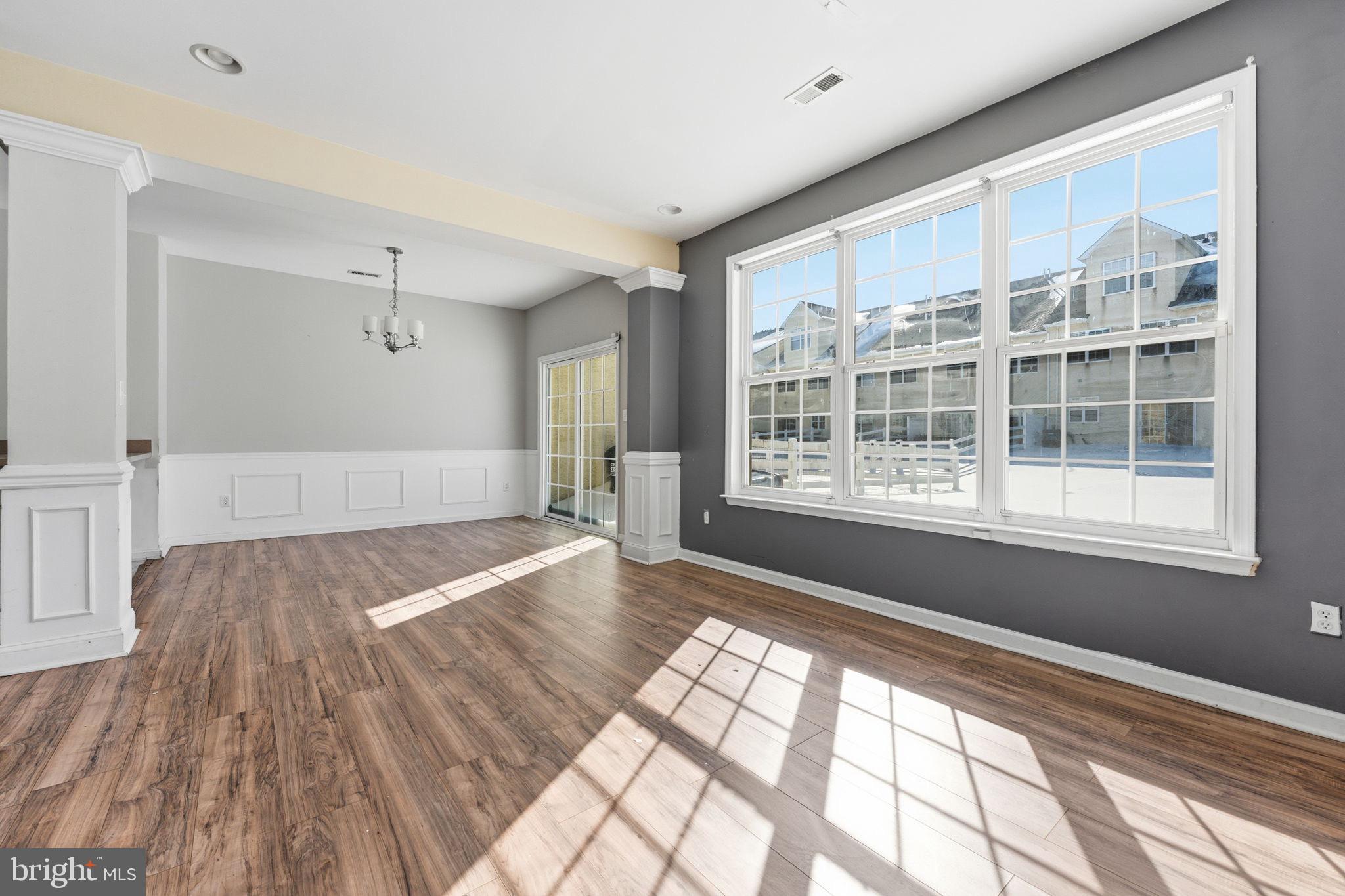 187 Gillespie Avenue Middletown, DE 19709 - Photo 18 of 43 a view of an empty room with wooden floor and a window