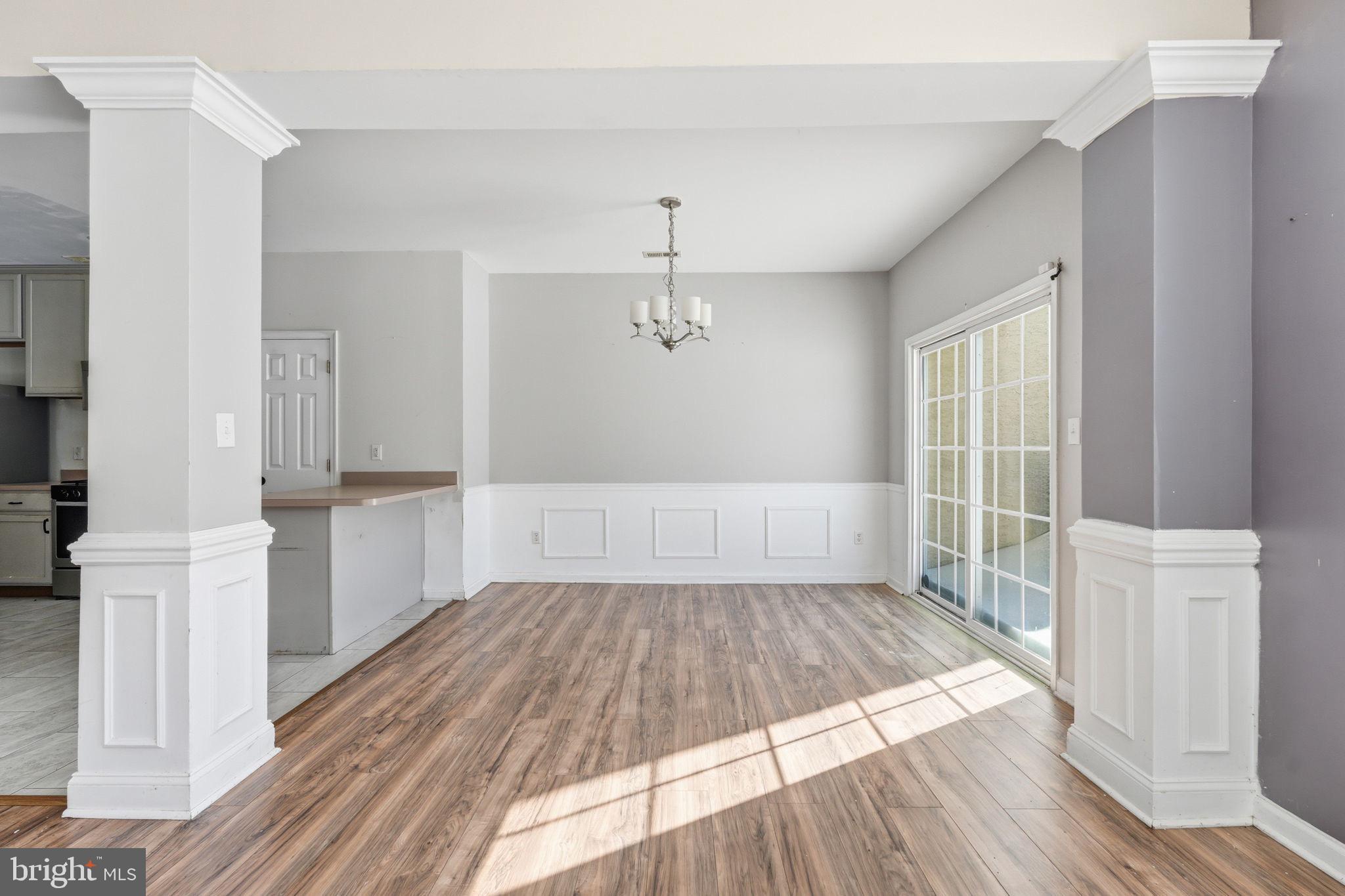 187 Gillespie Avenue Middletown, DE 19709 - Photo 19 of 43 wooden floor in an empty room with a window