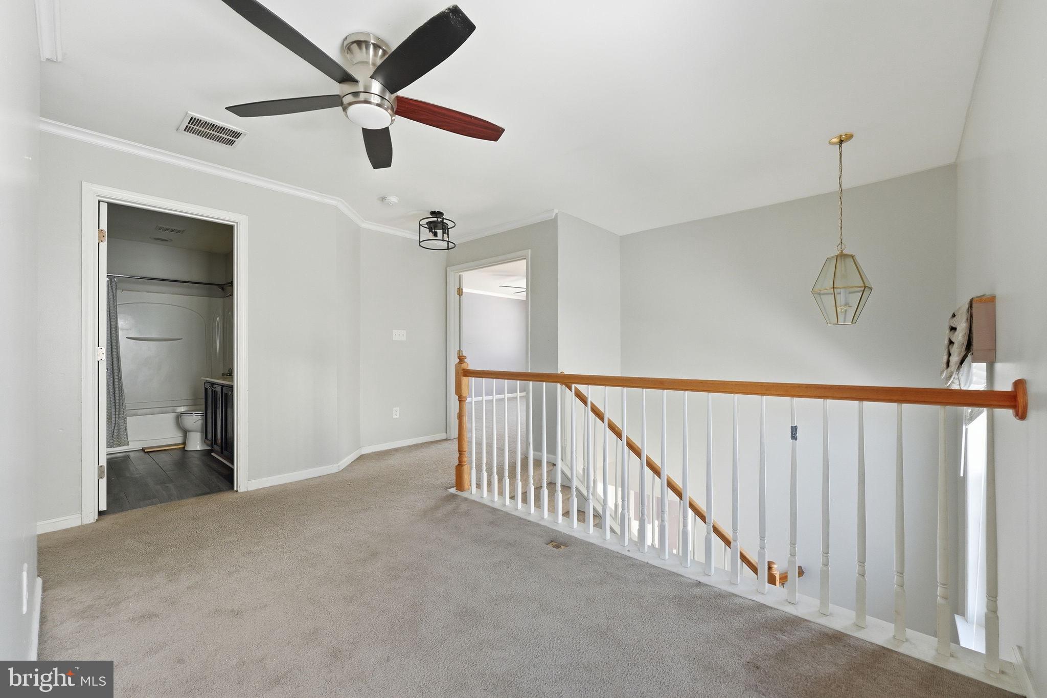 187 Gillespie Avenue Middletown, DE 19709 - Photo 26 of 43 a view of a hallway with a ceiling fan