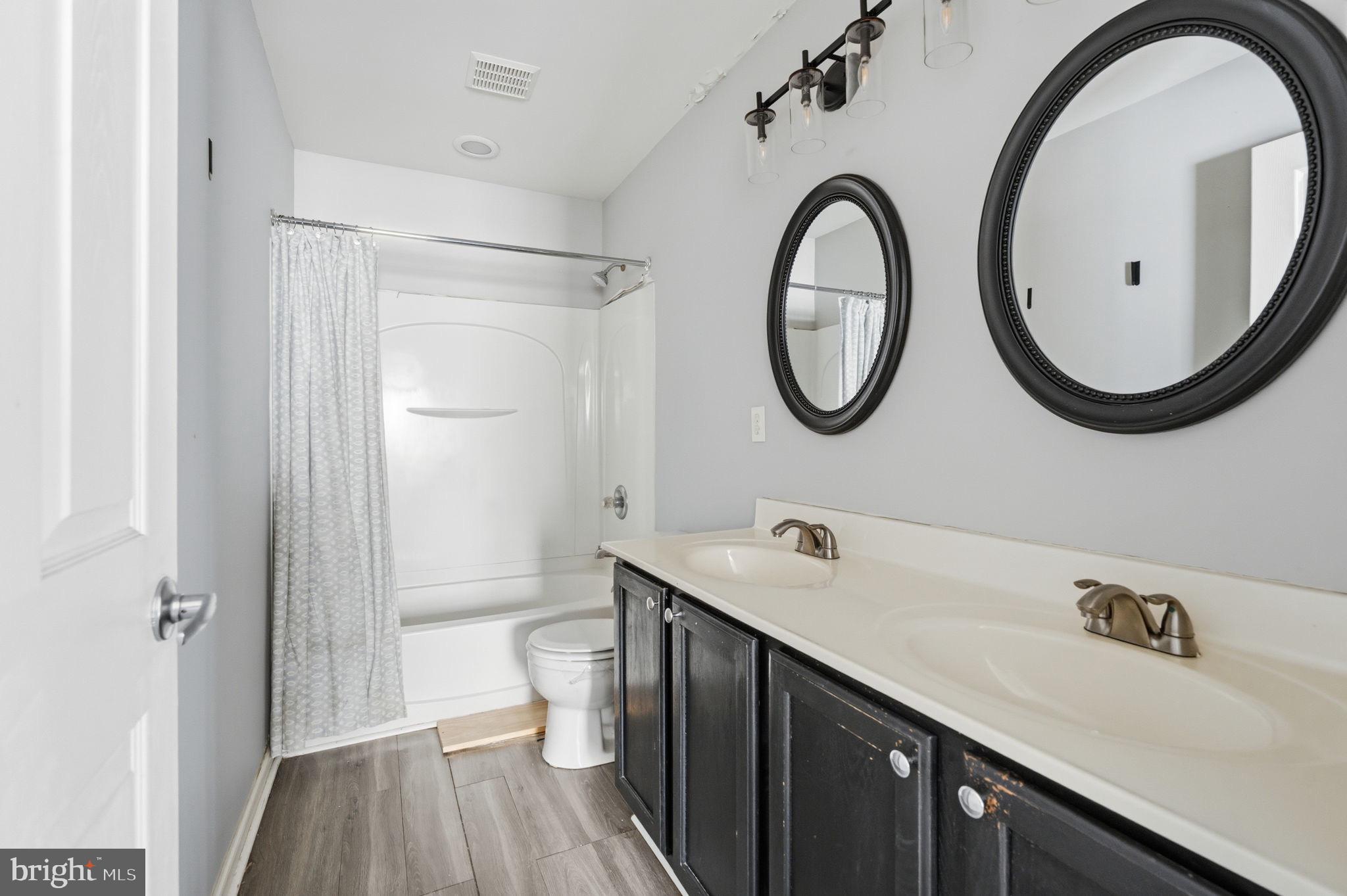 187 Gillespie Avenue Middletown, DE 19709 - Photo 28 of 43 a bathroom with a toilet a sink and a mirror