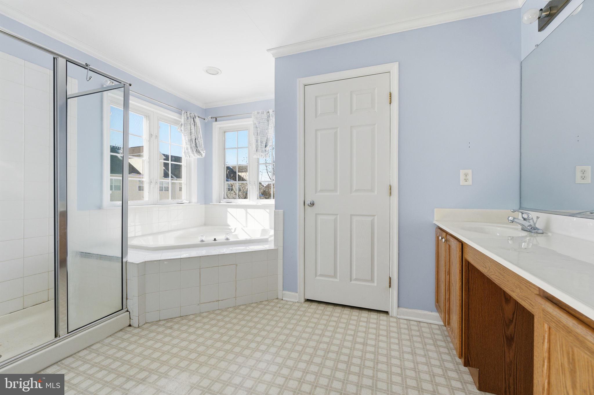 187 Gillespie Avenue Middletown, DE 19709 - Photo 31 of 43 a bathroom with a granite countertop sink a bathtub and shower