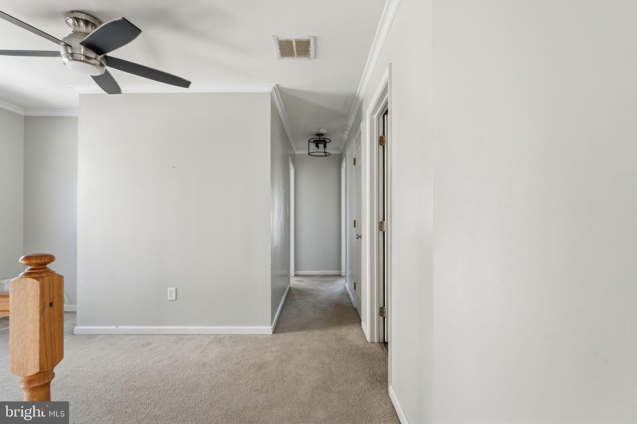 187 Gillespie Avenue Middletown, DE 19709 - Photo 36 of 43 a view of a hallway with a white cabinet and a shower