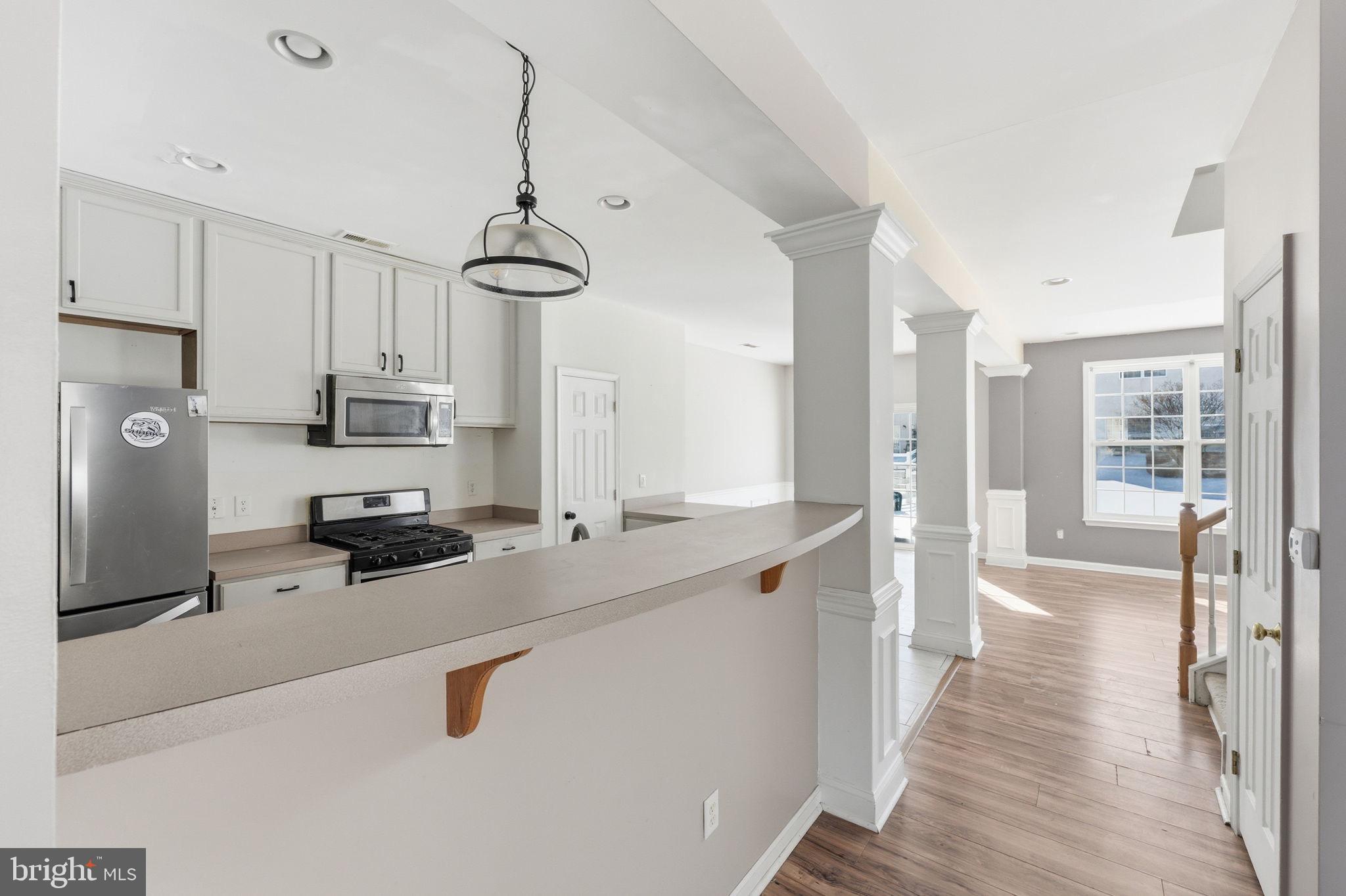 187 Gillespie Avenue Middletown, DE 19709 - Photo 7 of 43 a kitchen with stainless steel appliances a sink stove and refrigerator