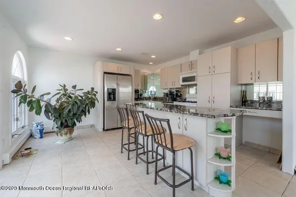 a kitchen with a table and chairs in it