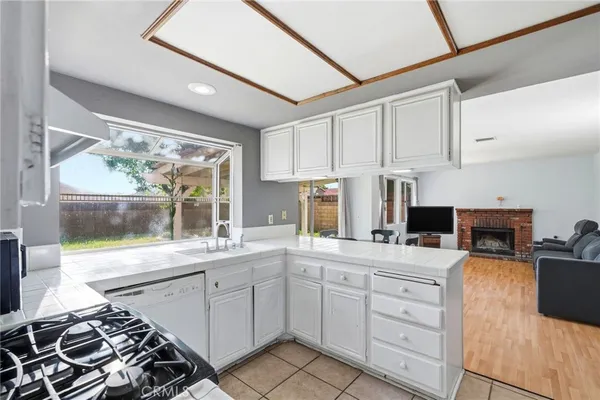 a kitchen with a stove a sink and a refrigerator