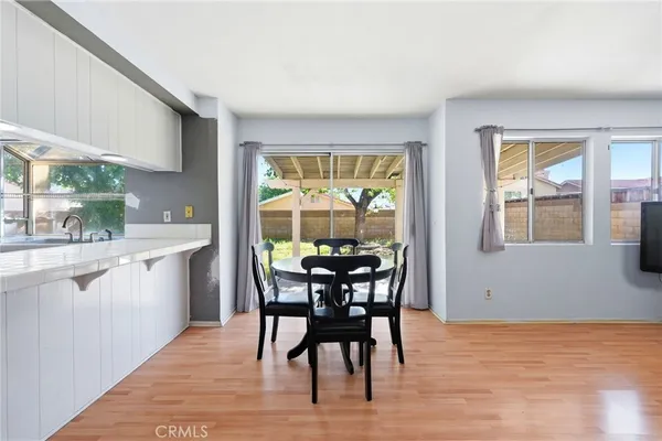 a view of a dining room with furniture and window