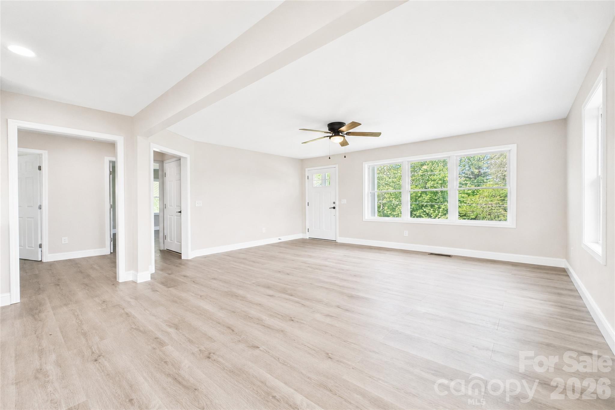 1403 Dudley Shoals Road Granite Falls, NC 28630 - Photo 11 of 34 wooden floor in an empty room with a window