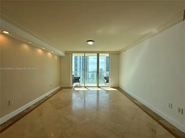 a view of an empty room with a window