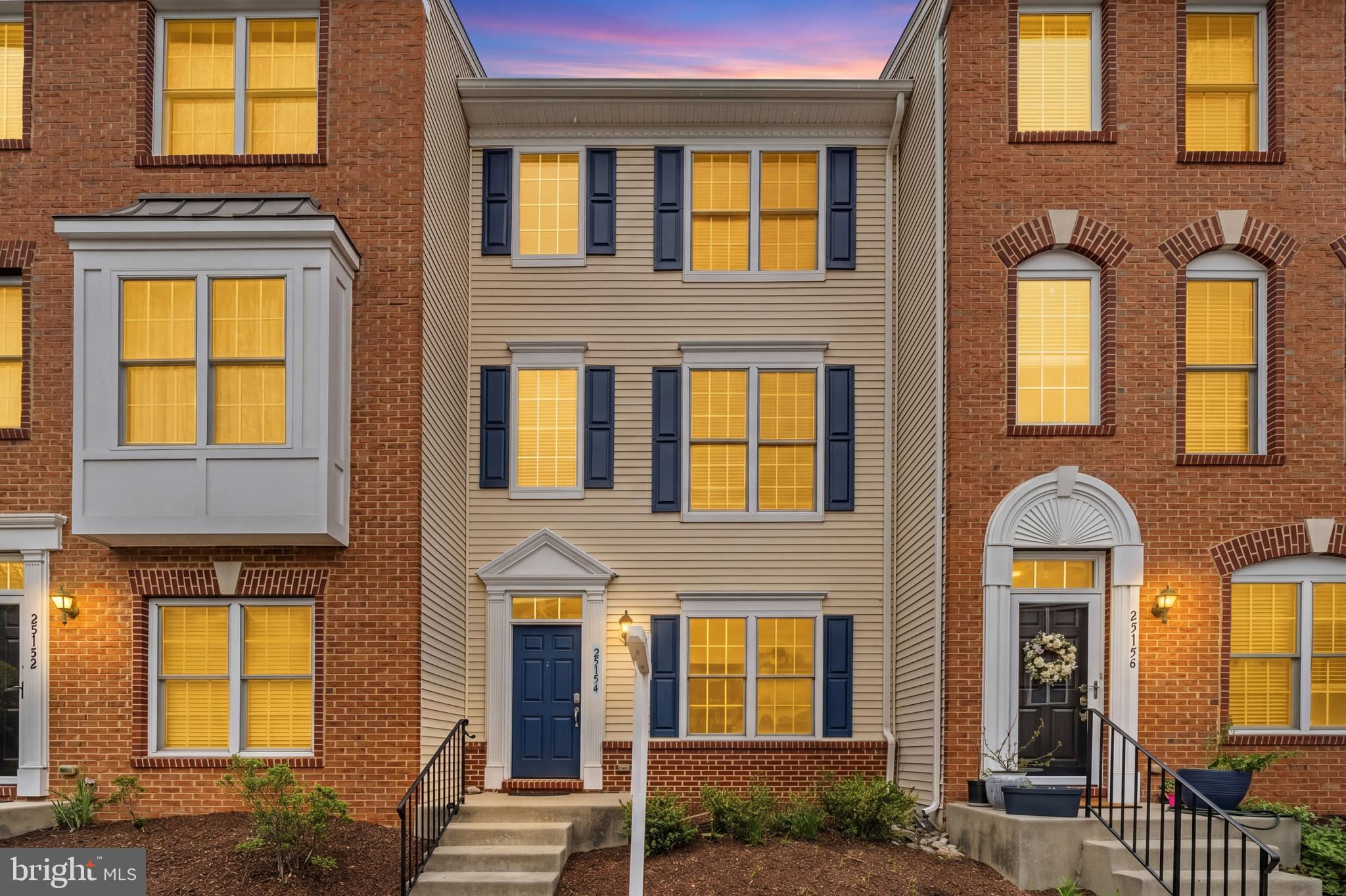 25154 Monteith Terrace Chantilly, VA 20152 - Photo 2 of 40 a front view of a brick house many windows