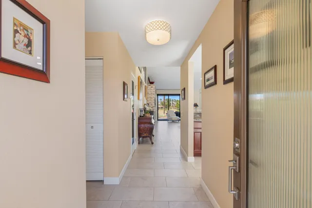 a kitchen with granite countertop stainless steel appliances a stove microwave and sink