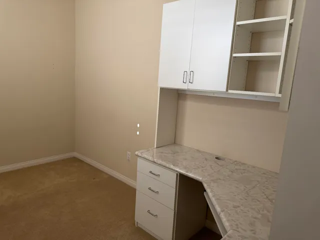 a utility room with sink dryer and washer