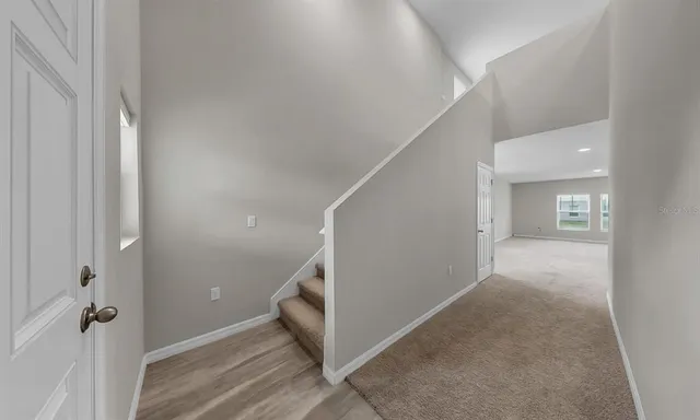 a view of empty room with windows