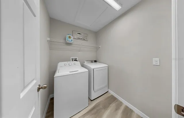 a view of a swimming pool with a lounge chair