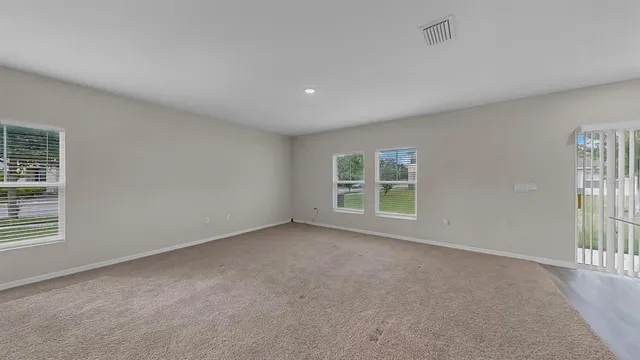 a kitchen with refrigerator cabinets and a sink