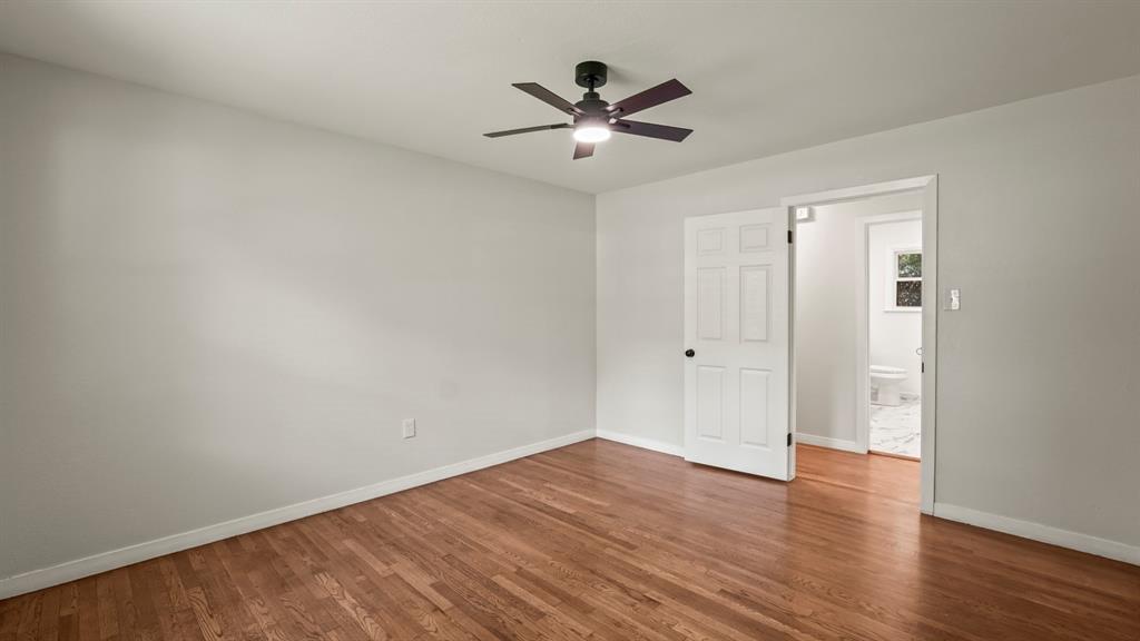 4600 Robinwood Drive Waco, TX 76708 - Photo 13 of 24 a view of an empty room with wooden floor