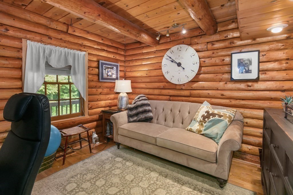 331 Edson Road Oakham, MA 01068 - Photo 20 of 40 a living room with furniture and a large window