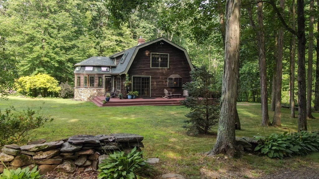 331 Edson Road Oakham, MA 01068 - Photo 3 of 40 a front view of a house with garden