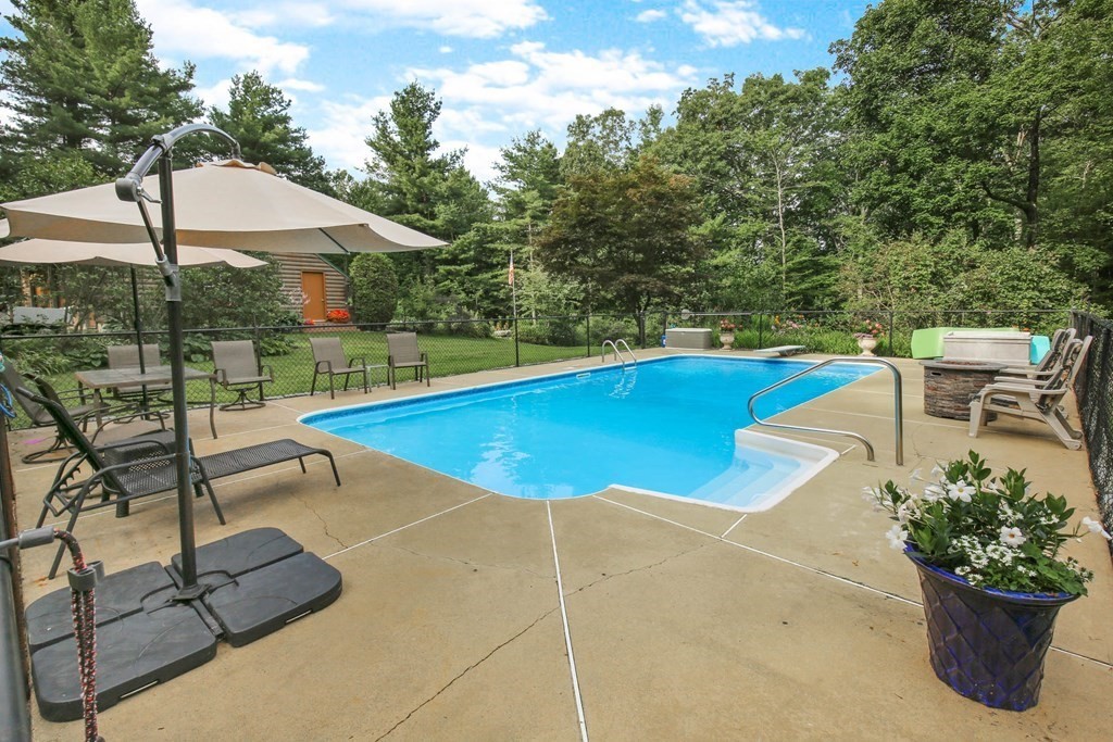 331 Edson Road Oakham, MA 01068 - Photo 5 of 40 a view of a swimming pool with a patio