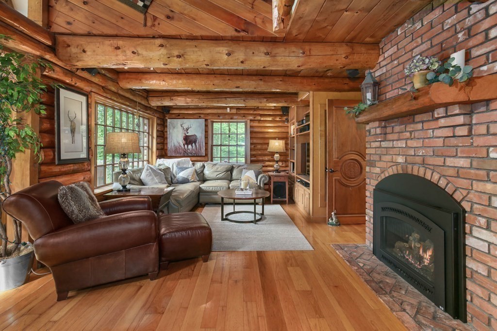 331 Edson Road Oakham, MA 01068 - Photo 8 of 40 a living room with furniture and a fireplace