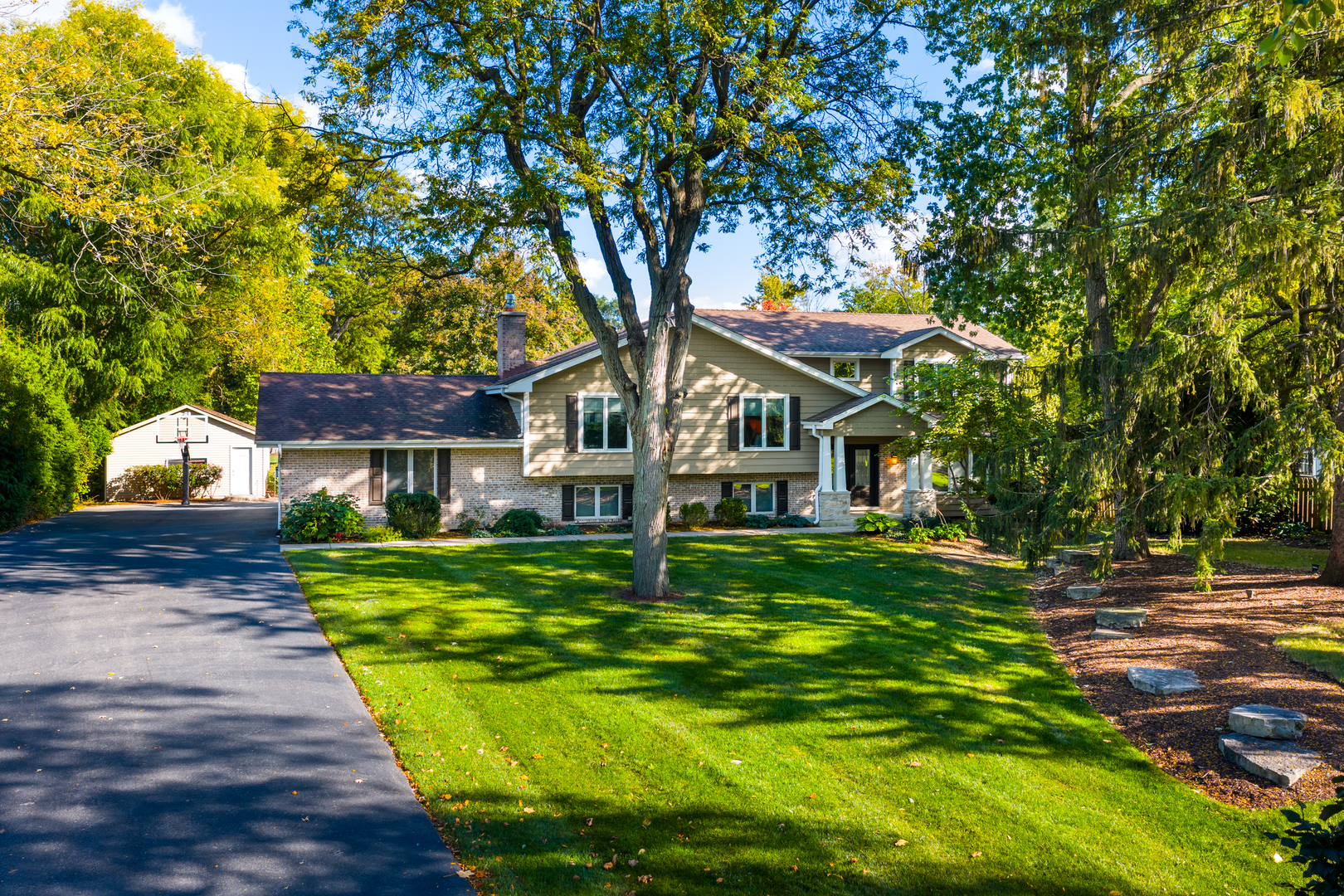 4733 Roslyn Road Downers Grove, IL 60515 - Photo 1 of 46 a front view of a house with garden