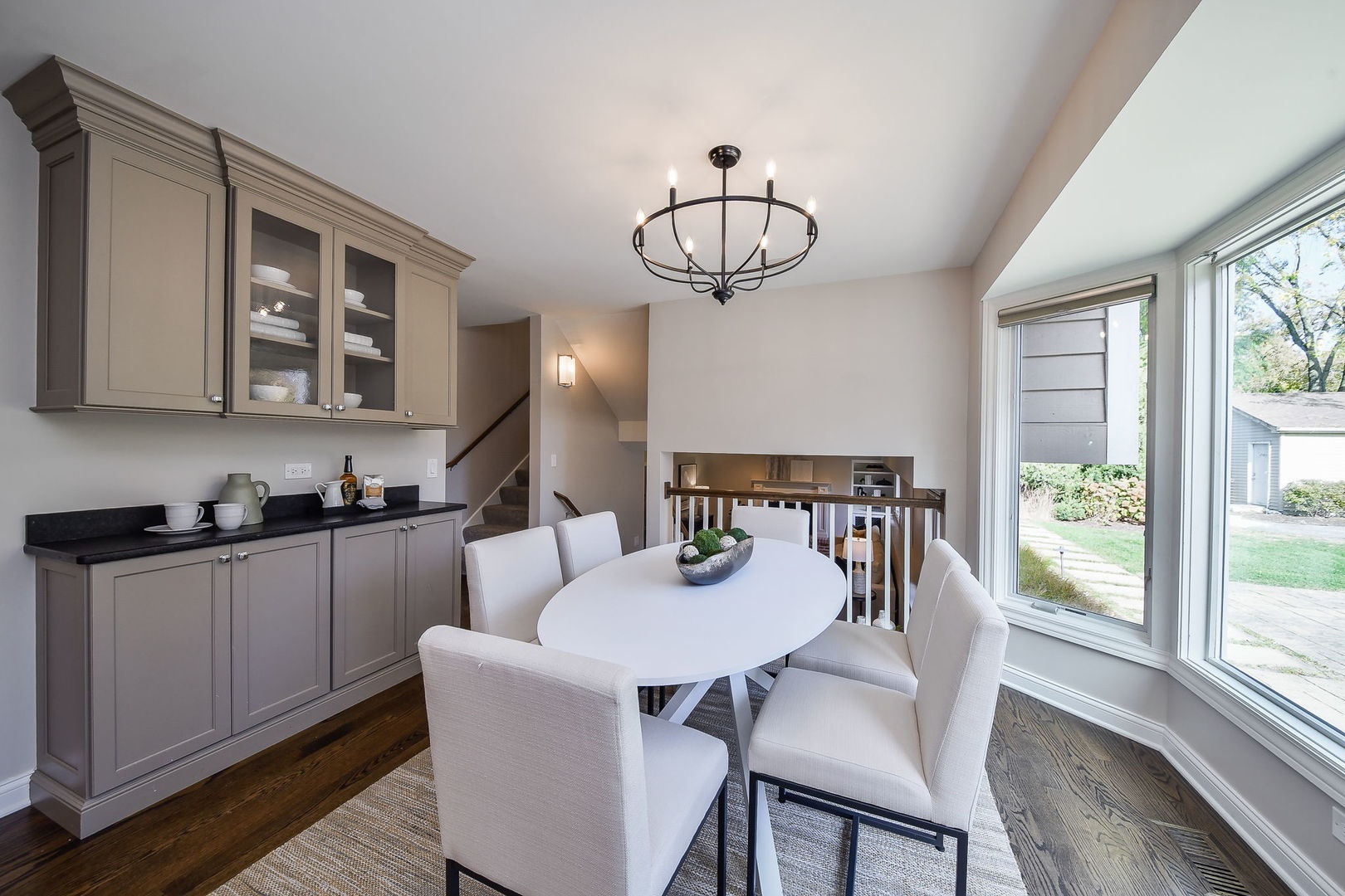 4733 Roslyn Road Downers Grove, IL 60515 - Photo 11 of 46 a view of a dining room with furniture window and wooden floor