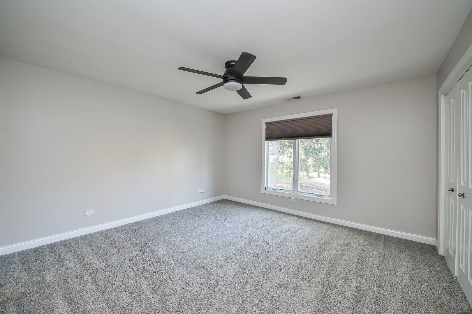 4733 Roslyn Road Downers Grove, IL 60515 - Photo 26 of 46 a view of a room with a ceiling fan and window