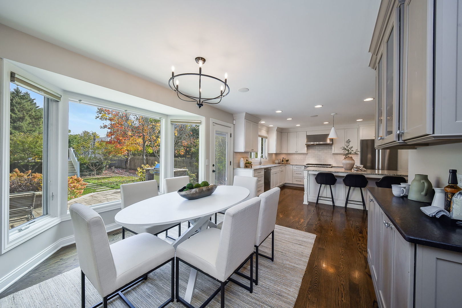 4733 Roslyn Road Downers Grove, IL 60515 - Photo 10 of 46 a view of a dining room with furniture wooden floor and chandelier