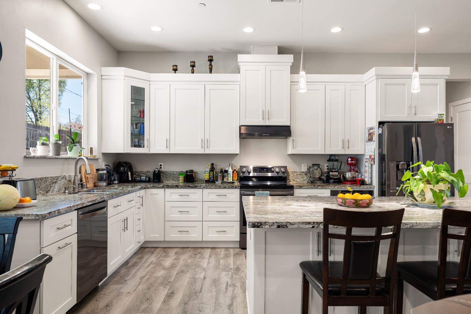 3629 Chelsea Road Cameron Park, CA 95682 - Photo 13 of 44 a kitchen with a sink white cabinets and appliances