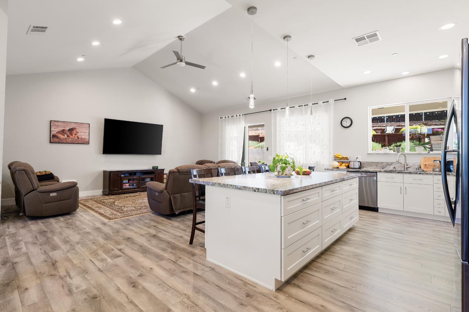 3629 Chelsea Road Cameron Park, CA 95682 - Photo 15 of 44 a kitchen with stainless steel appliances kitchen island granite countertop a sink and cabinets
